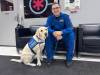 NICOLE BUFFIE / FREE PRESS
                                STARS air ambulance paramedic Grant Therrien with therapy dog Orion.