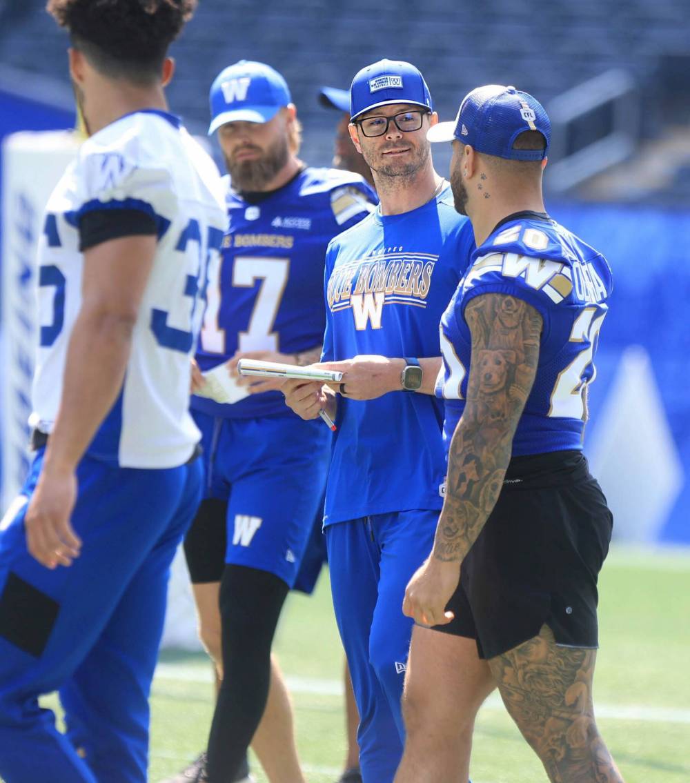 Ruth Bonneville / Free Press Files
Winnipeg Blue Bombers offensive co-ordinator Jason Hogan (second right) said Wednesday it’s been humbling for him so far this season — even without running back Brady Oliveira’s recent comments (right) — but overall it’s been “an awesome experience.”