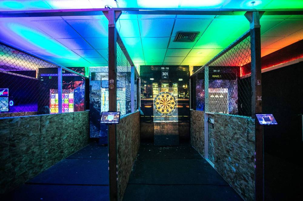 MIKAELA MACKENZIE / FREE PRESS
There are four axe-throwing lanes at Smash n Axe Arcade Disco.