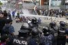 Riot police use water cannon on protesters during clashes outside parliament building in Kathmandu, Nepal, Monday, Sept. 8, 2025. (AP Photo/Niranjan Shrestha)