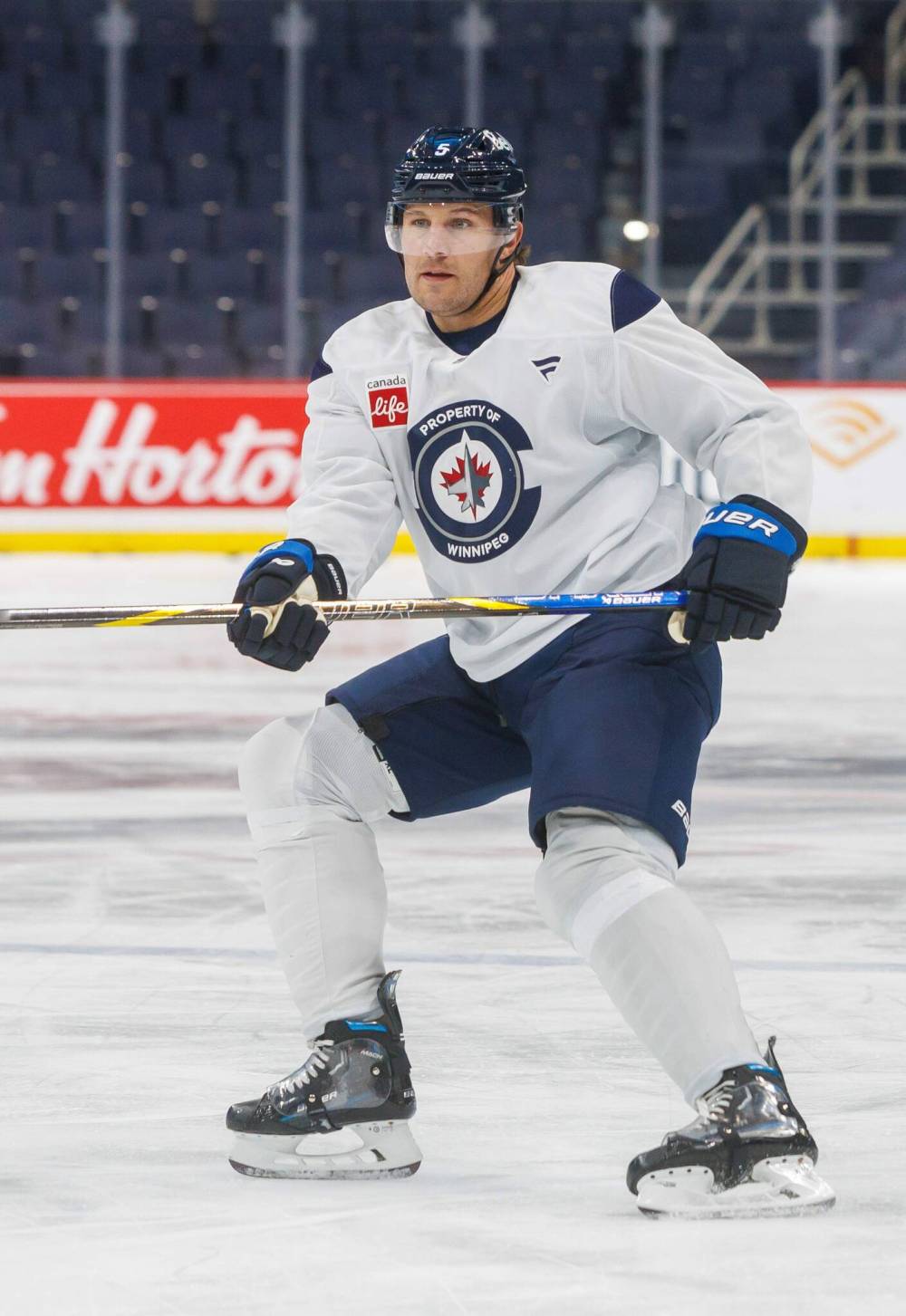 MIKE DEAL / FREE PRESS FILES
Winnipeg Jets defenceman, Luke Schenn (5) takes his first twirl with the team during an optional skate in March at Canada Life Centre.