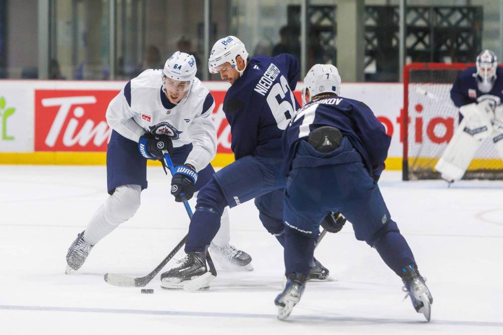 MIKE DEAL / FREE PRESS Winnipeg Jets’ Logan Stanley (64), Nino Niederreiter (62), and Vladislav Namestnikov (7) during training camp at Hockey For All Centre Thursday on Thursday, September 18, 2025.