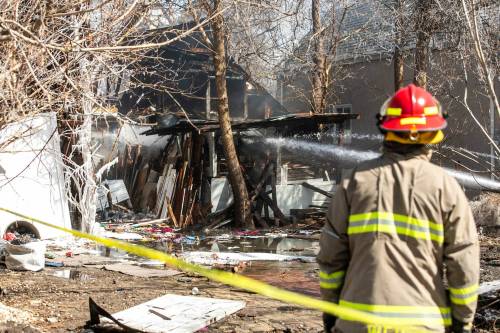 MIKAELA MACKENZIE / FREE PRESS
                                Firefighters at the scene of a vacant building fire on Magnus Avenue, near Arlington Street.