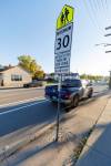 MIKE DEAL / FREE PRESS
                                The 30km/hr sign sits very close to the intersection of Banning Street with a Photo Enforcement vehicle (blue pickup) positioned immediately after it. Cindy Gilroy has repeatedly advocated for improvements, such as a lit sidewalk, in the area and brighter signage. Greenway School (390 Burnell) in the West End was among the top most dangerous-zones for drivers. Reporter: Maggie Macintosh 250926 - Friday, September 26, 2025.