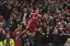 Liverpool's Virgil van Dijk celebrates after scoring his side's third goal during the Champions League opening phase soccer match between Liverpool and Atletico Madrid at Anfield stadium in Liverpool, England, Wednesday, Sept. 17, 2025. (AP Photo/Jon Super)