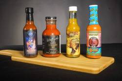 photos by Eva Wasney / Free Press
                                Free Press staffers Eva Wasney and Ben Sigurdson tasted four different locally made hot sauces.