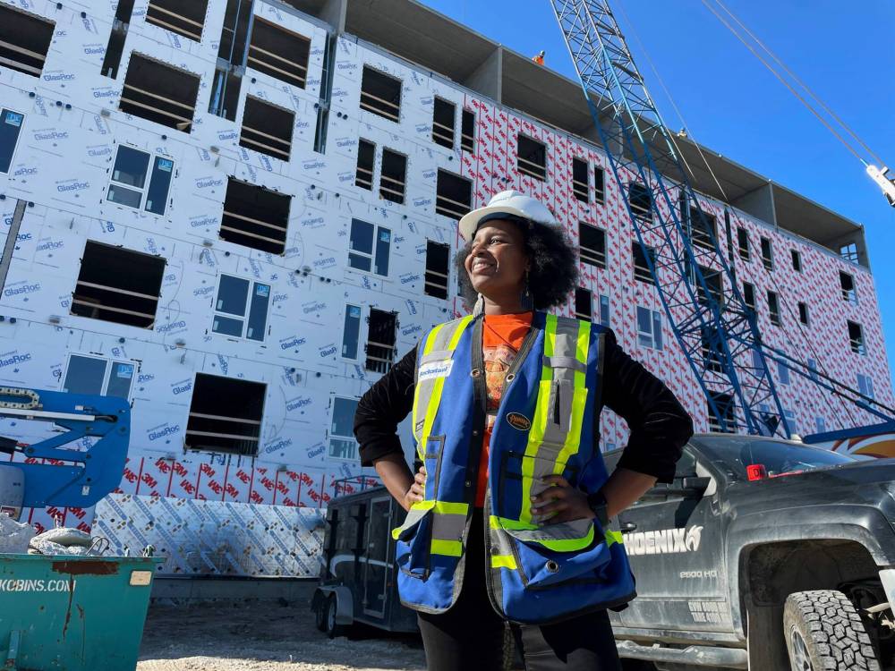 RUTH BONNEVILLE / FREE PRESS
Naomi Gichungu, chief executive officer of Inuka Community, Inc., at the site of the affordable housing complex at 1510 Main St. on Monday. The complex is set to house 72 rental units.