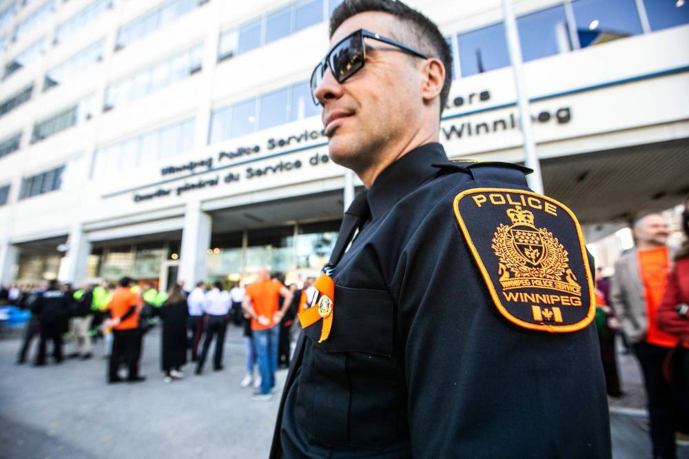 MIKAELA MACKENZIE / FREE PRESS
Staff Sgt. Shaun Venn wears a special orange badge during Monday's ceremony.
