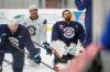MIKE DEAL / FREE PRESS FILES
                                Winnipeg Jets’ Ethan Frisch (73), Dylan Samberg (54), and goalie Connor Hellebuyck (37) hit the ice during training camp on Sept. 18. Hellebuyck missed Monday’s practice and Samberg is out with a broken wrist.