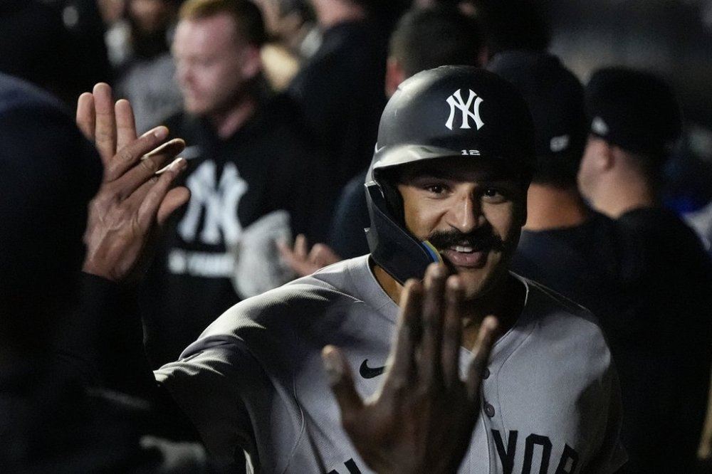 New York Yankees' Trent Grisham (12) celebrates his three-run home run against the Minnesota Twins in the fourth inning of a baseball game, Wednesday, Sept. 17, 2025, in Minneapolis. (AP Photo/Mike Stewart)
