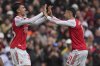 Arsenal's Martín Zubimendi, left, and Gabriel Martinelli celebrate after a goal during the Premier League soccer match between Arsenal and Nottingham Forest in London, Saturday, Sept. 13, 2025. (AP Photo/Kin Cheung)