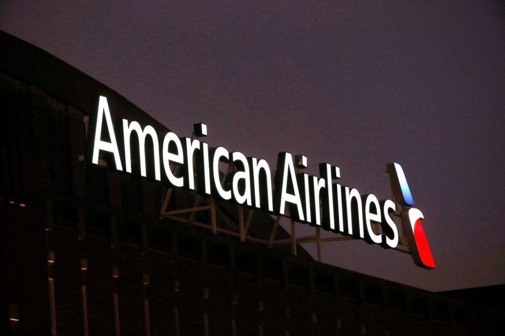 FILE - The American Airlines logo is seen atop the American Airlines Center in Dallas, Dec. 19, 2017. Five flight attendants and one passenger went to a hospital after an American Airlines flight from Los Angeles made a hard landing on Maui, Saturday, Jan. 27, 2024. (AP Photo/Michael Ainsworth, File)