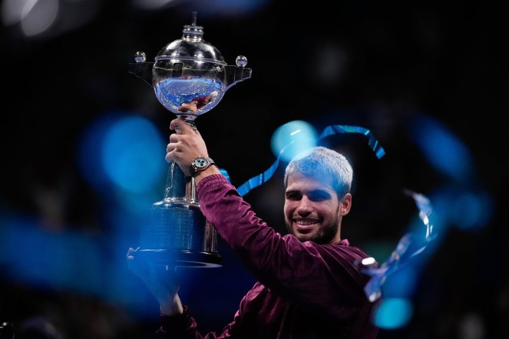 Winner Spain's Carlos Alcaraz, poses with the trophy after the men's final match against United States' Taylor Fritz at the Tokyo ATP 500 tennis tournament at Ariake Coliseum, in Tokyo, Japan, Tuesday, Sept. 30, 2025. (AP Photo/Louise Delmotte)
