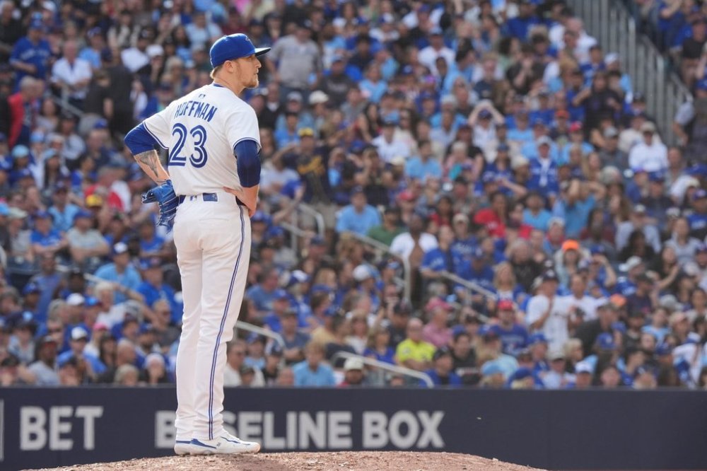 Toronto Blue Jays pitcher Jeff Hoffman (23) looks on after giving a solo home run to Milwaukee Brewers outfielder Christian Yelich during ninth inning MLB baseball action in Toronto on Saturday, August 30, 2025. THE CANADIAN PRESS/Frank Gunn