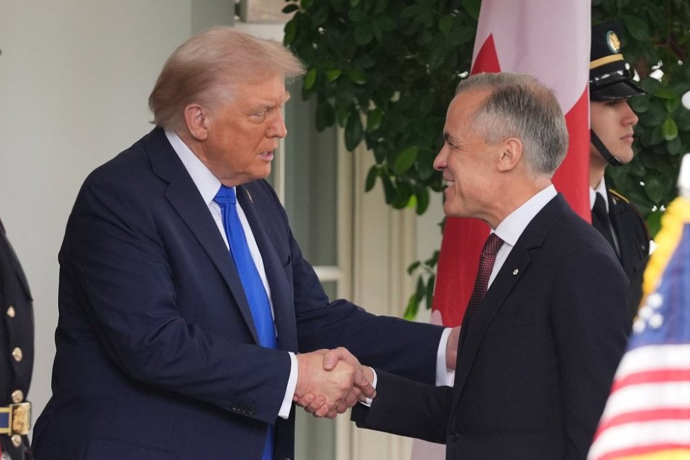 President Donald Trump greets Canadian Prime Minister Mark Carney at the White House, Tuesday, Oct. 7, 2025, in Washington. (AP Photo/Evan Vucci)