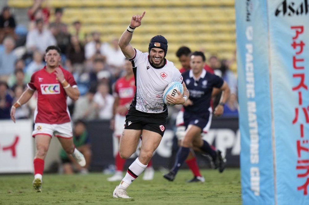Takoda McMullin of Canada runs to score a try during a the Pacific Nations Cup match against Tonga at Prince Chichibu Memorial Stadium in Tokyo, Saturday, Sept. 14, 2024.(AP Photo/Shuji Kajiyama)