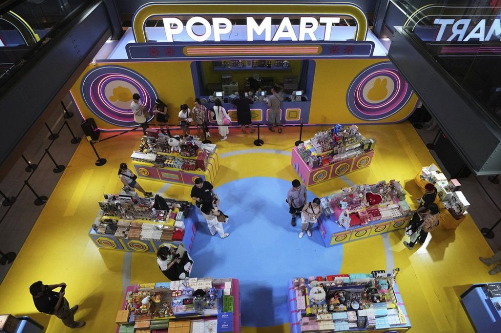 Customers shop around for toys at the Chinese toy maker Pop Mart in Bangkok, Thailand, Thursday, May 8, 2025. (AP Photo/Sakchai Lalit)