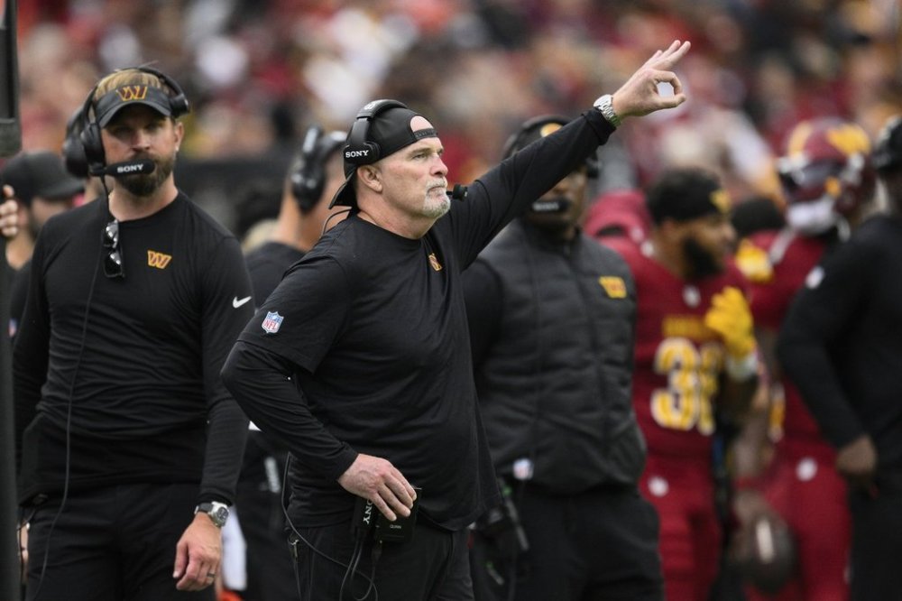 Washington Commanders Dan Quinn reacts on the sideline during the second half of NFL football game against the Las Vegas Raiders, Sunday, Sept. 21, 2025, in Landover, Md. (AP Photo/Nick Wass)
