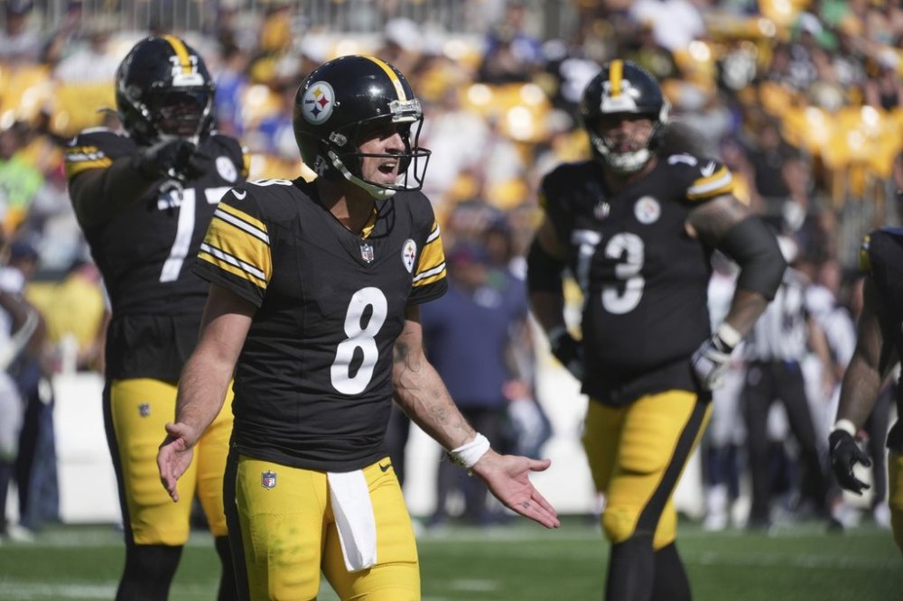 Pittsburgh Steelers quarterback Aaron Rodgers (8) gestures to the sidelines after being sacked during the second half of an NFL football game against the Seattle Seahawks, Sunday, Sept. 14, 2025, in Pittsburgh. (AP Photo/Gene J Puskar)