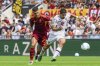 Roma's Gianluca Mancini, left, and Torino's Giovanni Simeone fight for the ball during the Serie A soccer match between AS Roma and Torino FC at the Rome's Olympic stadium, Italy, Sunday Sept. 14, 2025. (Fabrizio Corradetti/LaPresse via AP)