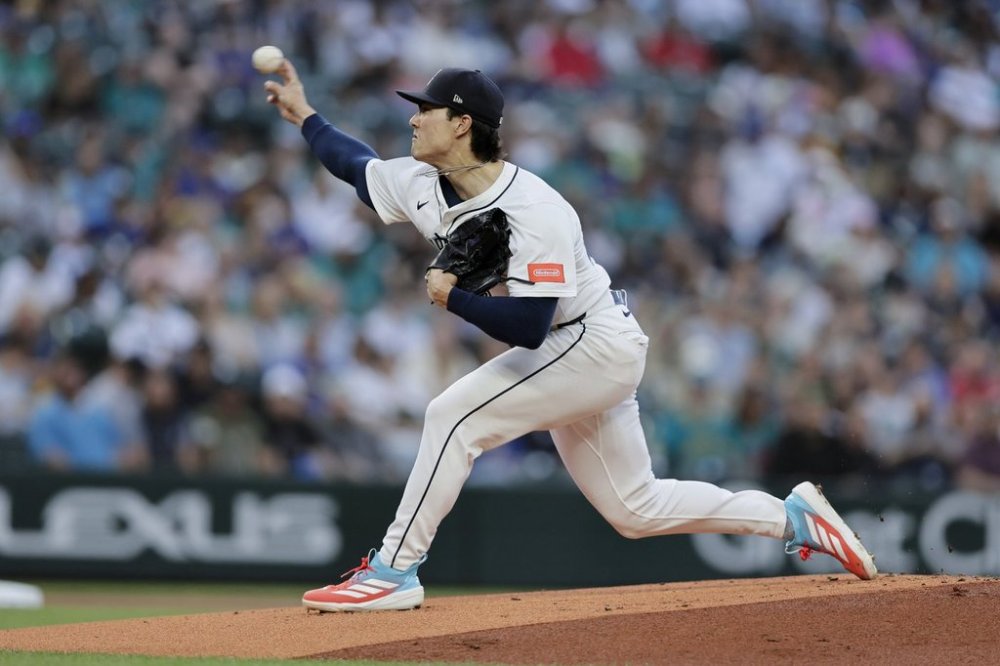 Seattle Mariners starting pitcher Bryan Woo throws against the Los Angeles Angels during the first inning of a baseball game Saturday, Sept. 13, 2025, in Seattle. (AP Photo/John Froschauer)
