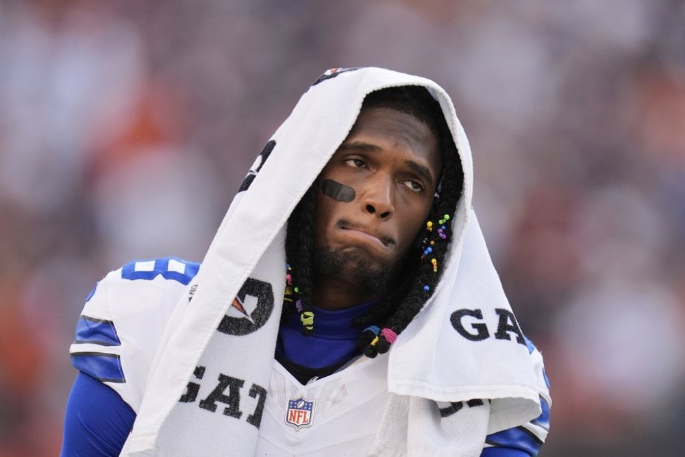 Dallas Cowboys wide receiver CeeDee Lamb walks along the sideline in the second half of an NFL football game against the Chicago Bears Sunday, Sept. 21, 2025, in Chicago. (AP Photo/Erin Hooley)
