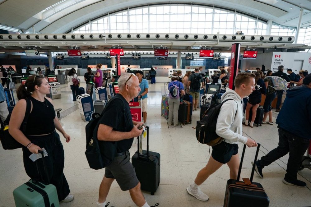 The Air Canada check-in area inside Terminal 1 of Toronto Pearson International Airport is pictured in Mississauga, Ont., on Wednesday, Aug. 13, 2025. THE CANADIAN PRESS/Arlyn McAdorey