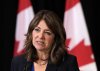 Alberta Premier Danielle Smith speaks to the media after signing a memorandum of understanding with Ontario and Saskatchewan during the 2025 summer meetings of Canada's Premiers at Deerhurst Resort in Huntsville, Ont., on Tuesday, July 22, 2025. THE CANADIAN PRESS/Nathan Denette