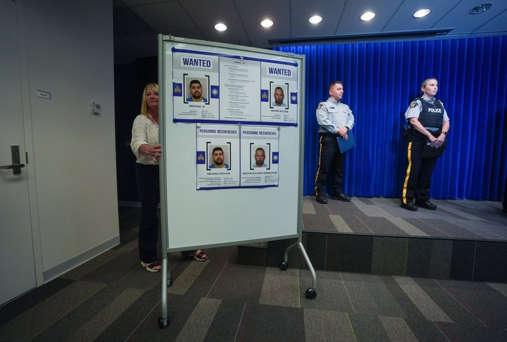 Photos of Rabih Alkhalil and John Potvin are wheeled into an RCMP news conference, in Surrey, B.C., on Monday, Sept. 8, 2025. THE CANADIAN PRESS/Darryl Dyck
