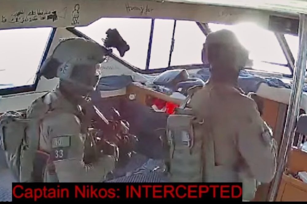 This frame grab from video released by the Global Sumud Flotilla shows Israeli navy soldiers aboard one of the flotilla's vessels after it was intercepted as it approached the coast of Gaza early Thursday, Oct. 2, 2025. (Global Sumud Flotilla via AP)