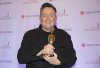 Mike Ward holds up his trophy at the Gala Olivier awards ceremony in Montreal, Sunday, Dec. 8, 2019. THE CANADIAN PRESS/Graham Hughes