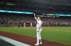 Seattle Mariners' Cal Raleigh waves to the crowd after hitting his 60th home run during the eighth inning of a baseball game against the Colorado Rockies, Wednesday, Sept. 24, 2025, in Seattle. (AP Photo/Ryan Sun)