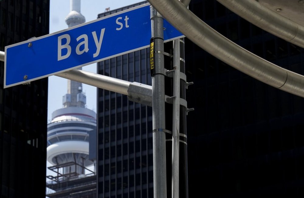 The Bay Street Financial District is shown next to the CN Tower in Toronto on Friday, August 5, 2022. THE CANADIAN PRESS/Nathan Denette