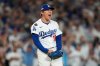 Los Angeles Dodgers pitcher Yoshinobu Yamamoto reacts after striking out Cincinnati Reds' Elly De La Cruz during the sixth inning in Game 2 of the National League Wild Card baseball playoff series Wednesday, Oct. 1, 2025, in Los Angeles. (AP Photo/Mark J. Terrill)