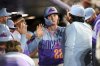 Colorado Rockies' Mickey Moniak (22) celebrates in the dugout after scoring in the fifth inning of a baseball game against the Los Angeles Angels Friday, Sept. 19, 2025, in Denver. (AP Photo/Geneva Heffernan)