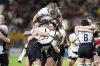 Canada's Courtney O'Donnell, top, and teammates celebrate after winning the Women's Rugby World Cup 2025 semifinal match between Canada and New Zealand at Ashton Gate, Bristol, England, Friday Sept. 19, 2025. (Andrew Matthews/PA via AP)