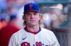 Philadelphia Phillies' Harrison Bader looks on from the dugout during the sixth inning of a baseball game against the Minnesota Twins, Sunday, Sept. 28, 2025, in Philadelphia. (AP Photo/Chris Szagola)