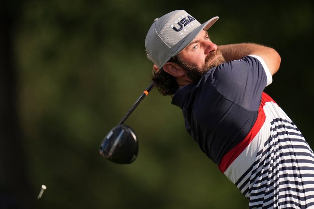 United States' Cameron Young watches his tee shot on the 12th hole at Bethpage Black golf course during the Ryder Cup golf tournament, Friday, Sept. 26, 2025, in Farmingdale, N.Y. (AP Photo/Seth Wenig)