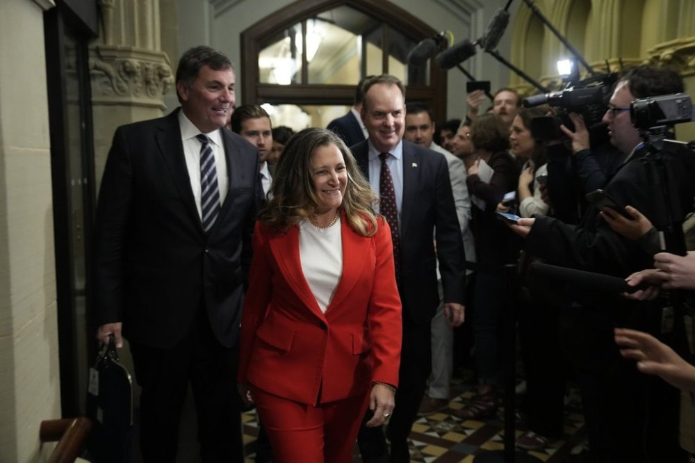 King’s Privy Council President Dominic LeBlanc, Minister of Transport and Internal Trade Chrystia Freeland and Government House leader Steven MacKinnon walk past media before attending cabinet on Parliament Hill in Ottawa on Tuesday, Sept. 16, 2025. THE CANADIAN PRESS/Adrian Wyld