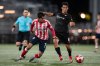 Ottawa Atletico's David Rodriguez (7) and Vancouver FC's Vasco Fry (6) vie for the ball during second half Canadian Championship semifinal soccer action, in Langley, B.C., on Wednesday, August 13, 2025. THE CANADIAN PRESS/Ethan Cairns