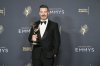 Jimmy Kimmel poses in the press room with the award for host for a game show for 
