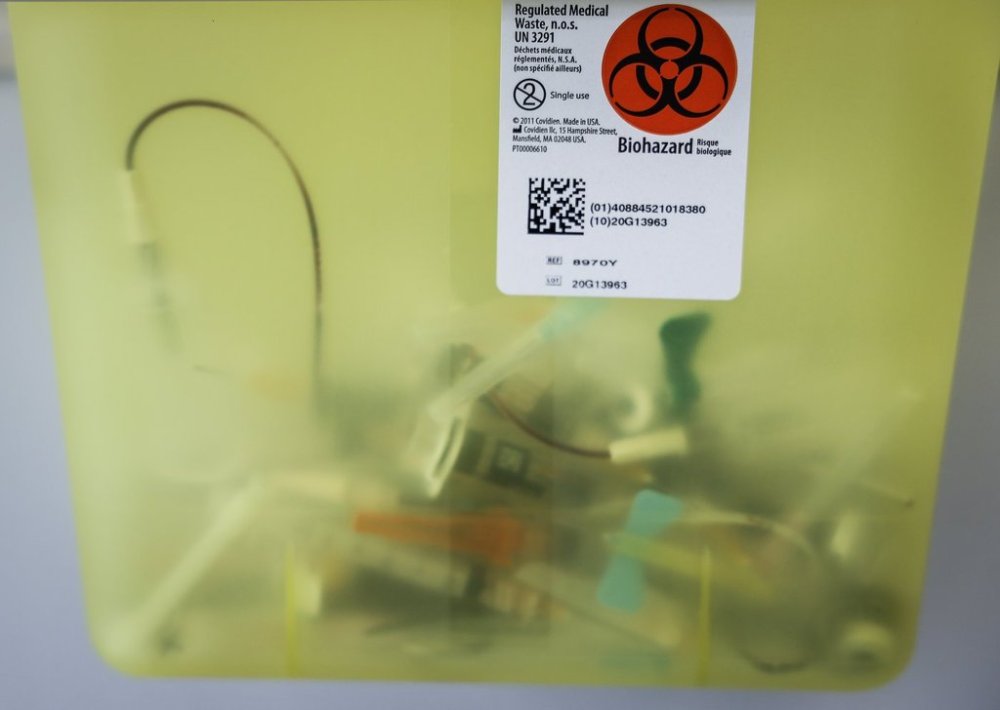 A biohazard receptacle in an exam room at a health clinic in Calgary, Friday, July 14, 2023.THE CANADIAN PRESS/Jeff McIntosh