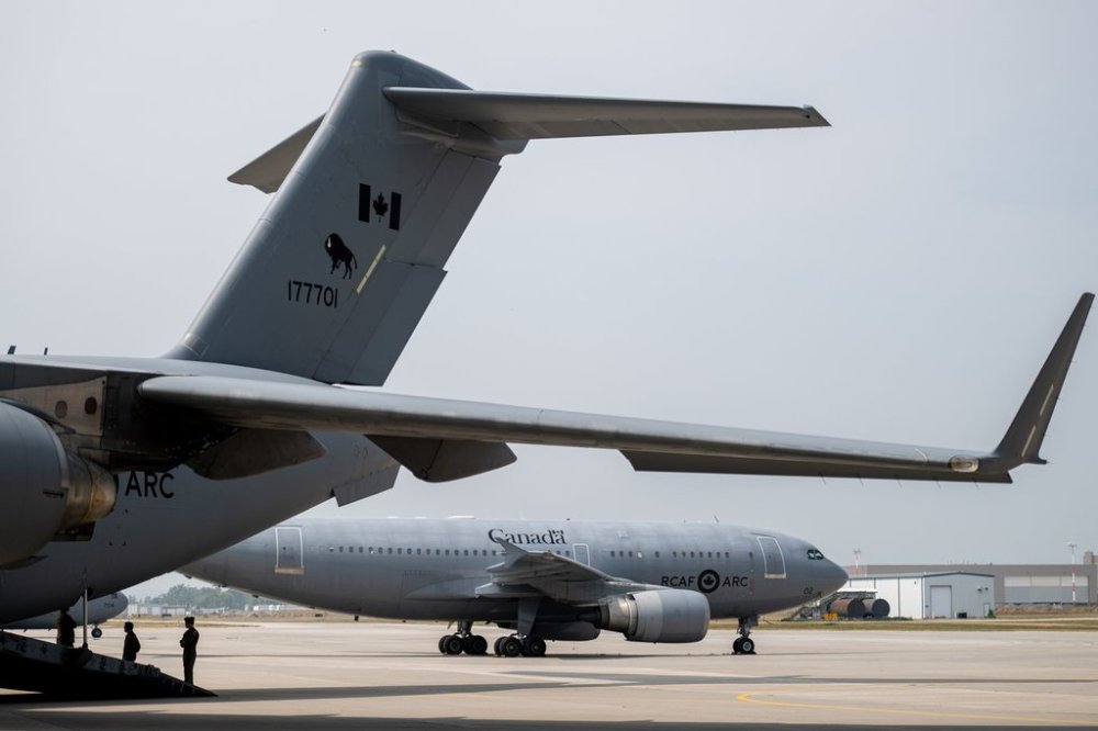A Royal Canadian Airforce (RCAF) Airbus CC-150 Polaris aircraft is seen near a Boeing CC-177 at Canadian Forces Base (CFB) 8 Wing Trenton in Trenton Ont., on Friday, Aug. 8, 2025. THE CANADIAN PRESS/Spencer Colby