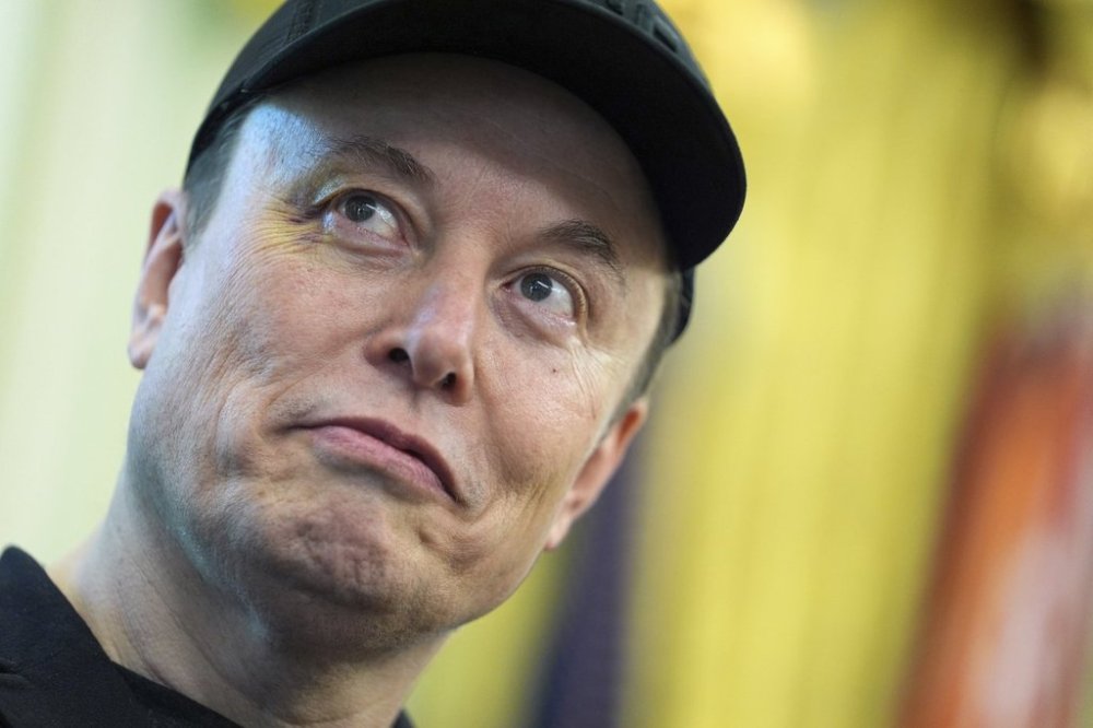 Elon Musk listens as President Donald Trump speaks during a news conference in the Oval Office of the White House, Friday, May 30, 2025, in Washington. (AP Photo/Evan Vucci)