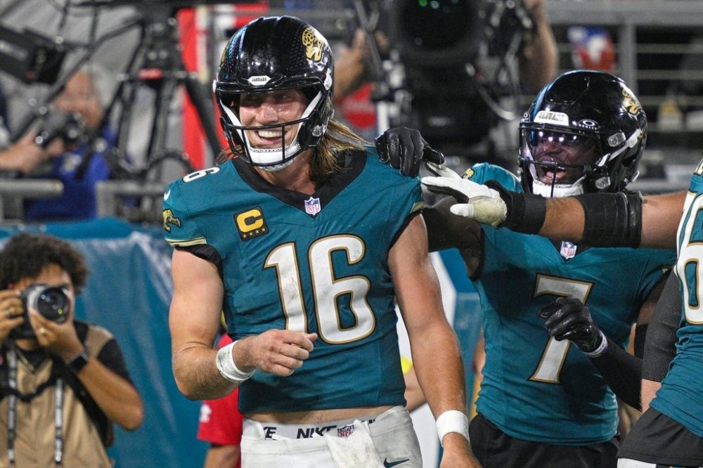 Jacksonville Jaguars quarterback Trevor Lawrence (16) celebrates with teammates after scoring a touchdown during the second half of an NFL football game against the Kansas City Chiefs, Monday, Oct. 6, 2025, in Jacksonville, Fla. (AP Photo/Phelan M. Ebenhack)