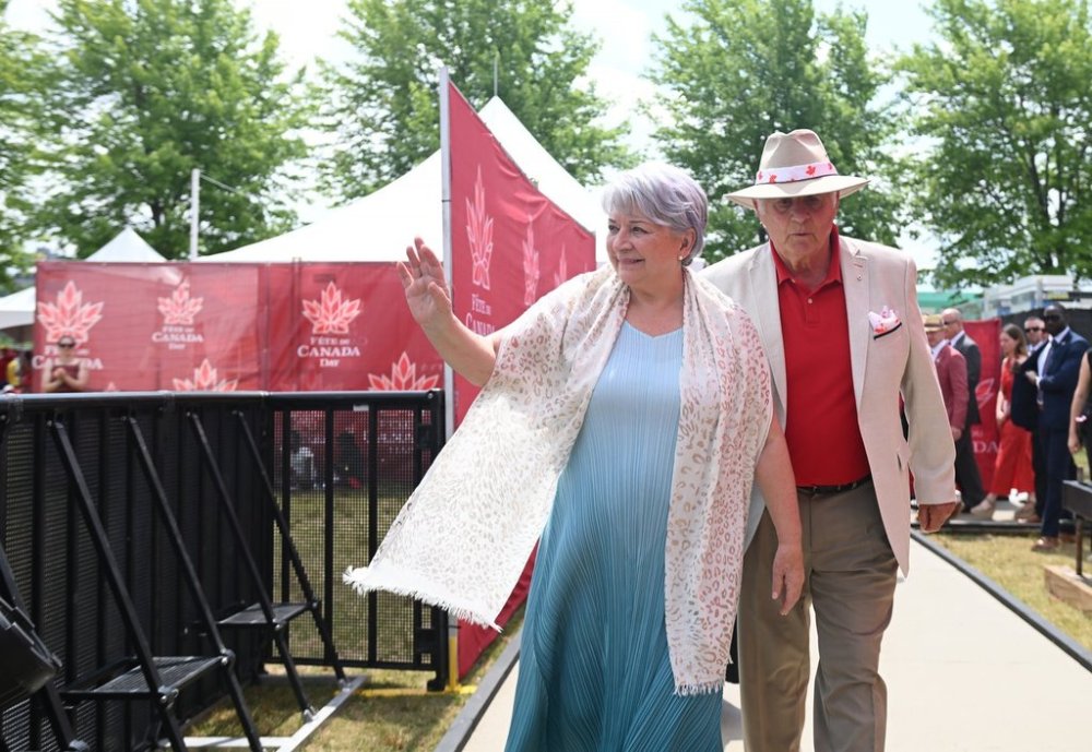 Gov. Gen. Mary Simon and Whit Fraser greet members of the public during Canada Day celebrations at LeBreton Flats in Ottawa on Tuesday, July 1, 2025. THE CANADIAN PRESS/Spencer Colby