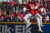 Cincinnati Reds shortstop Elly De La Cruz (44) and outfielder Noelvi Marte (16) bump shoulders after defeating the Chicago Cubs, Sunday, Sept. 21, 2025, in Cincinnati. (AP Photo/Michael Swensen)