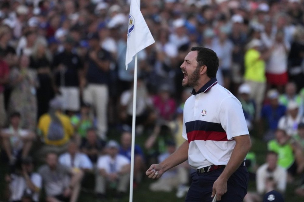 FILE - United States' Patrick Cantlay celebrates after holing his putt that led to him winning his afternoon Fourballs match on the 18th green at the Ryder Cup golf tournament at the Marco Simone Golf Club in Guidonia Montecelio, Italy, Sept. 30, 2023. (AP Photo/Andrew Medichini, File)