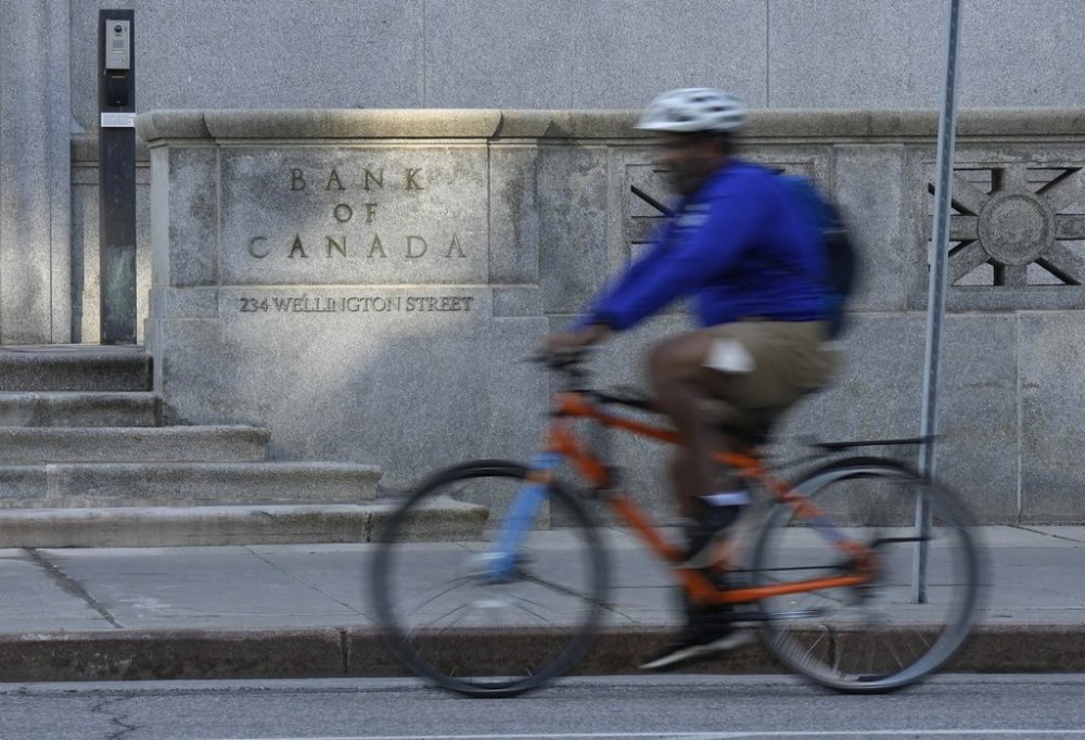 A cyclist rides past the Bank of Canada in Ottawa, Wednesday, Sept. 17, 2025. THE CANADIAN PRESS/Adrian Wyld