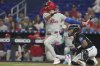 Philadelphia Phillies' Trea Turner hits a single during the first inning of a baseball game against the Miami Marlins Friday, Sept. 5, 2025, in Miami. (AP Photo/Marta Lavandier)